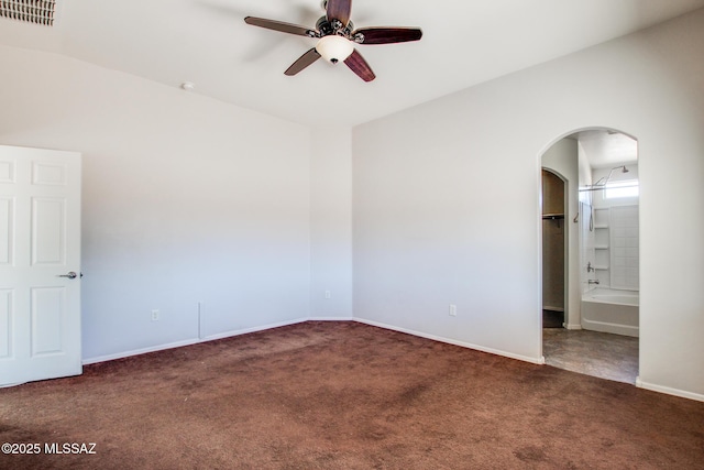 8068 S Nautilus Dr, Tucson, AZ 85756 - empty room with carpet, ceiling fan, arched walkways, and baseboards