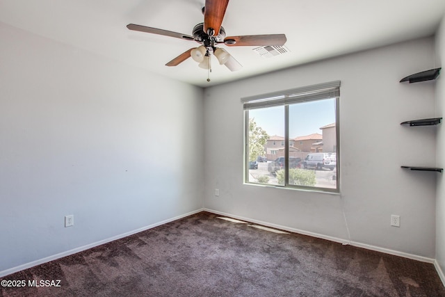 8068 S Nautilus Dr, Tucson, AZ 85756 - spare room featuring carpet floors, a ceiling fan, and baseboards