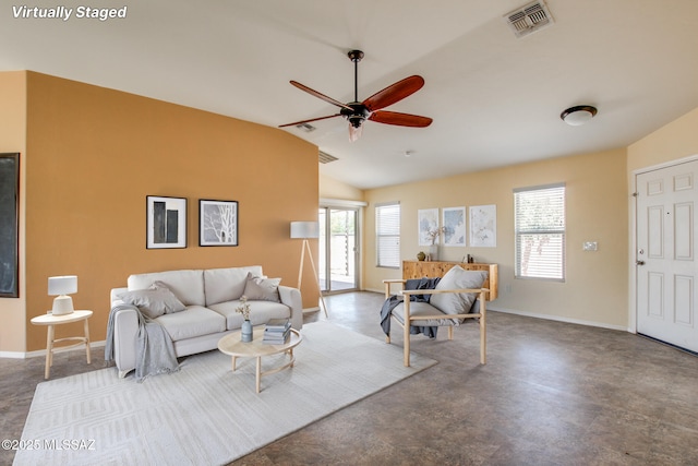 8068 S Nautilus Dr, Tucson, AZ 85756 - living room featuring ceiling fan, lofted ceiling, and concrete flooring
