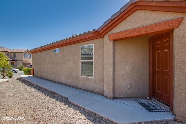 8068 S Nautilus Dr, Tucson, AZ 85756 - doorway to property featuring stucco siding