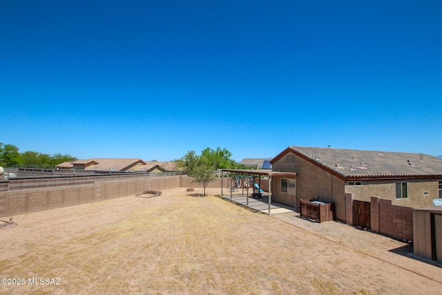8068 S Nautilus Dr, Tucson, AZ 85756 - fenced backyard with a patio
