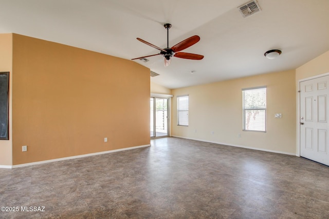 8068 S Nautilus Dr, Tucson, AZ 85756 - spare room with ceiling fan, baseboards, lofted ceiling, and finished concrete floors