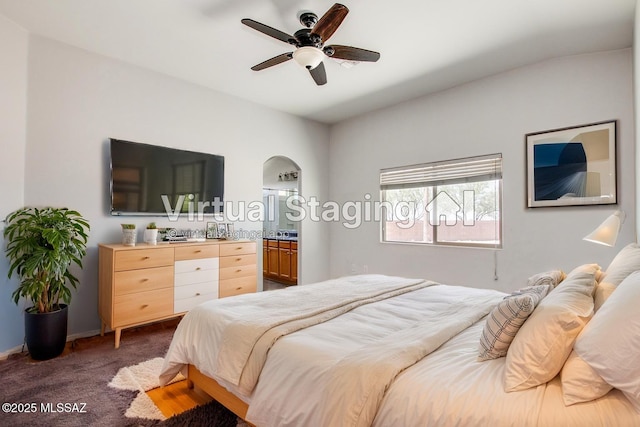 8068 S Nautilus Dr, Tucson, AZ 85756 - bedroom with carpet floors, arched walkways, and a ceiling fan