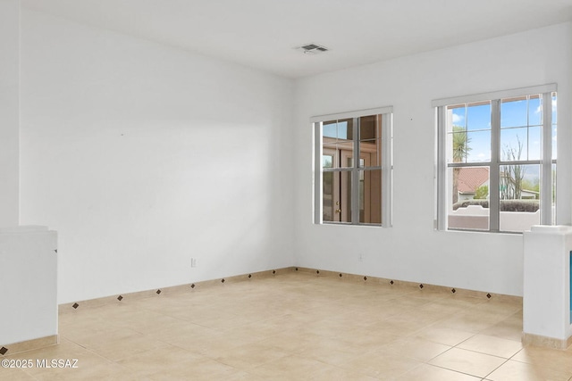 35 N Monument Estates Pl, Tucson, AZ 85748 - empty room featuring light tile patterned floors and baseboards