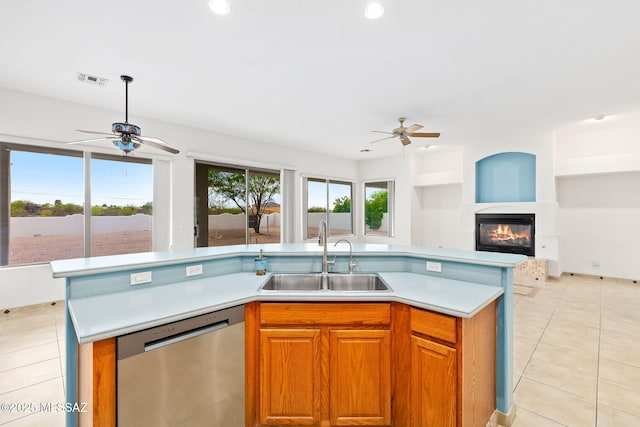 35 N Monument Estates Pl, Tucson, AZ 85748 - kitchen featuring stainless steel dishwasher, a sink, a ceiling fan, open floor plan, and light countertops