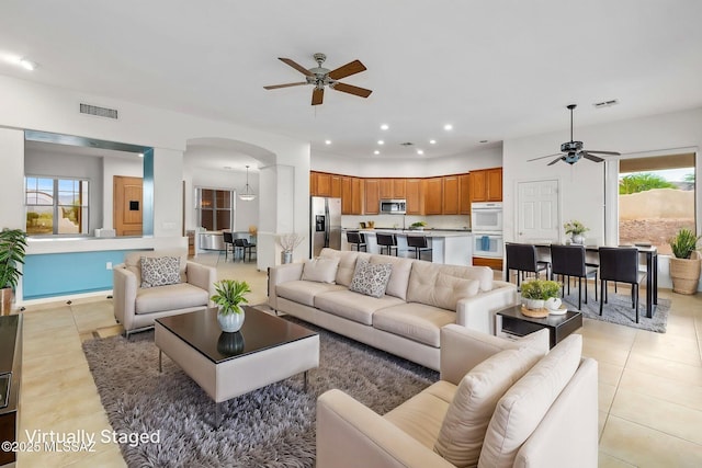 35 N Monument Estates Pl, Tucson, AZ 85748 - living area featuring ceiling fan, arched walkways, light tile patterned floors, recessed lighting, and baseboards