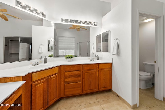 35 N Monument Estates Pl, Tucson, AZ 85748 - full bathroom with ceiling fan, double vanity, tile patterned floors, and a shower stall