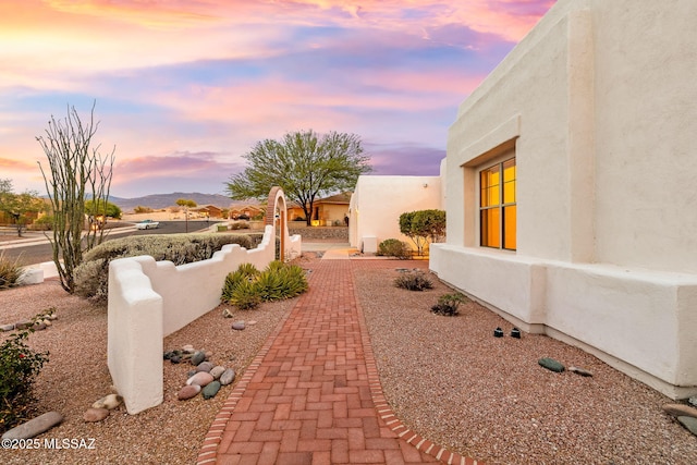 35 N Monument Estates Pl, Tucson, AZ 85748 - patio terrace at dusk featuring a mountain view