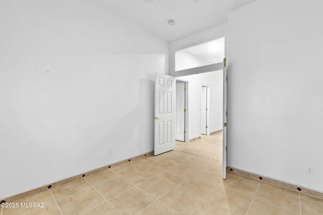 35 N Monument Estates Pl, Tucson, AZ 85748 - spare room with baseboards and high vaulted ceiling