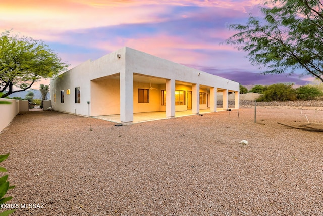 35 N Monument Estates Pl, Tucson, AZ 85748 - back of property with stucco siding and a patio