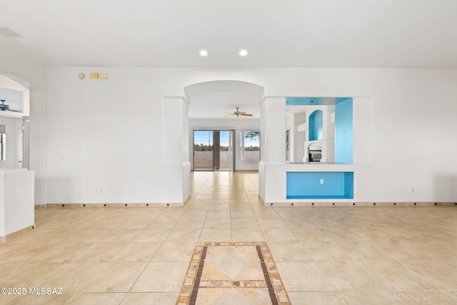 35 N Monument Estates Pl, Tucson, AZ 85748 - unfurnished room with ceiling fan, arched walkways, recessed lighting, baseboards, and light tile patterned floors