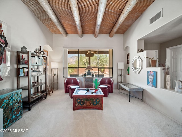 5475 E Placita De Royale, Tucson, AZ 85718 - carpeted living room with wood ceiling with exposed beams and arched walkways