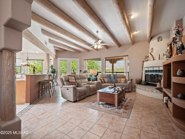 5475 E Placita De Royale, Tucson, AZ 85718 - living room featuring beamed ceiling, plenty of natural light, a ceiling fan, light tile patterned floors, and a fireplace