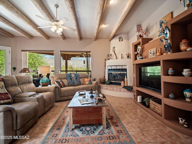 5475 E Placita De Royale, Tucson, AZ 85718 - living area with beam ceiling, ceiling fan, and a tiled fireplace