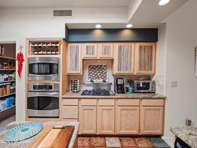 5475 E Placita De Royale, Tucson, AZ 85718 - kitchen featuring stainless steel appliances, backsplash, recessed lighting, light brown cabinets, and glass insert cabinets