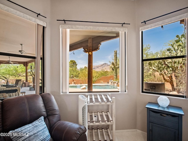 5475 E Placita De Royale, Tucson, AZ 85718 - living area with a ceiling fan, baseboards, healthy amount of natural light, and a mountain view