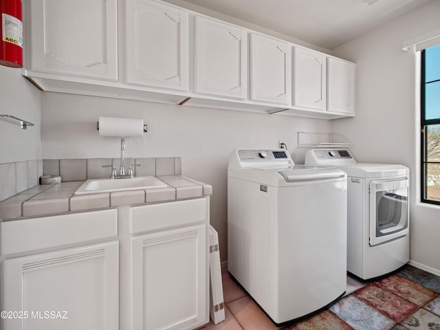 5475 E Placita De Royale, Tucson, AZ 85718 - laundry area featuring washing machine and dryer, cabinet space, and baseboards