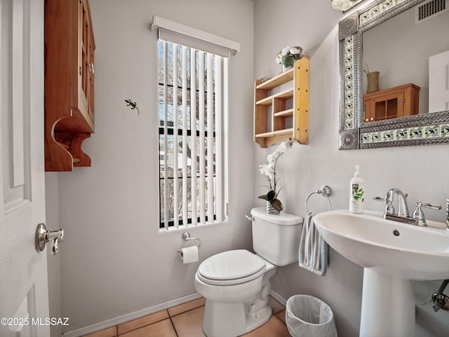 5475 E Placita De Royale, Tucson, AZ 85718 - bathroom featuring toilet, baseboards, tile patterned flooring, and a sink