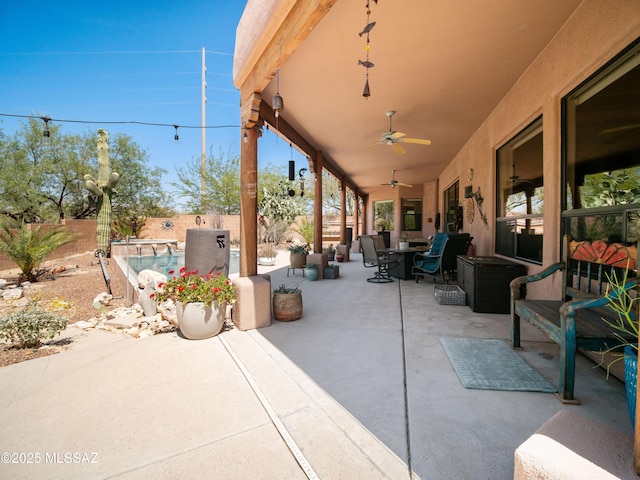 5475 E Placita De Royale, Tucson, AZ 85718 - fenced backyard featuring a ceiling fan, a patio area, and outdoor dining space