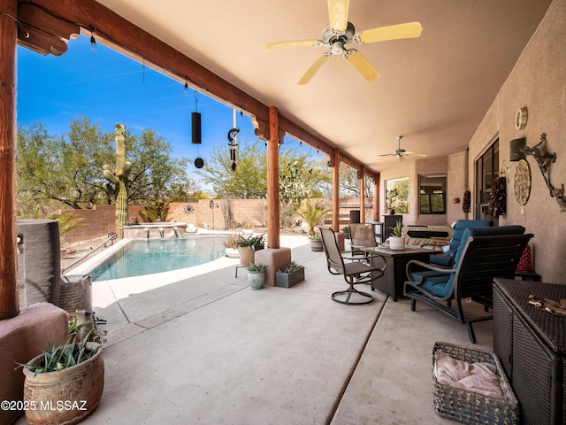 5475 E Placita De Royale, Tucson, AZ 85718 - fenced backyard with ceiling fan, a patio, and an outdoor hangout area