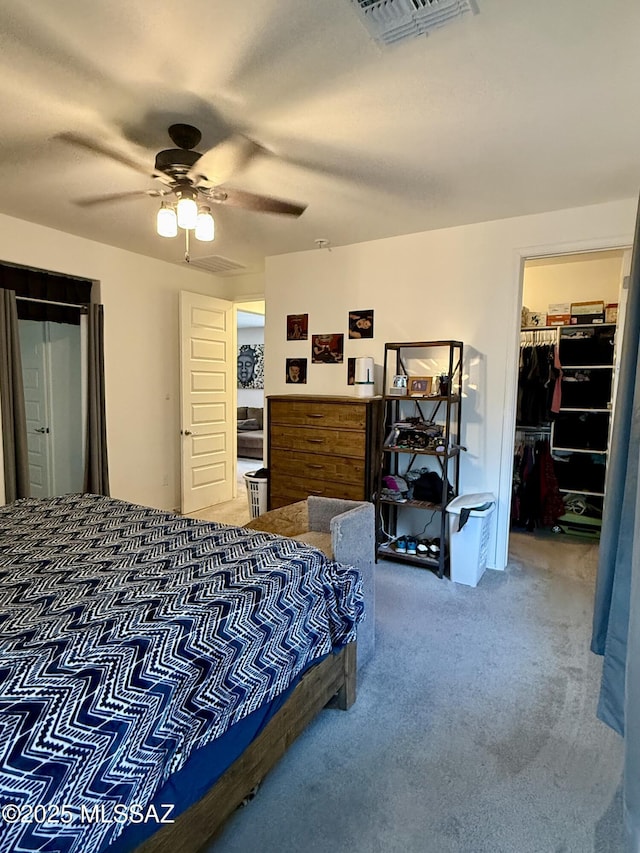 16038 S Camino Casal, Sahuarita, AZ 85629 - bedroom with carpet floors, a ceiling fan, a walk in closet, and a closet