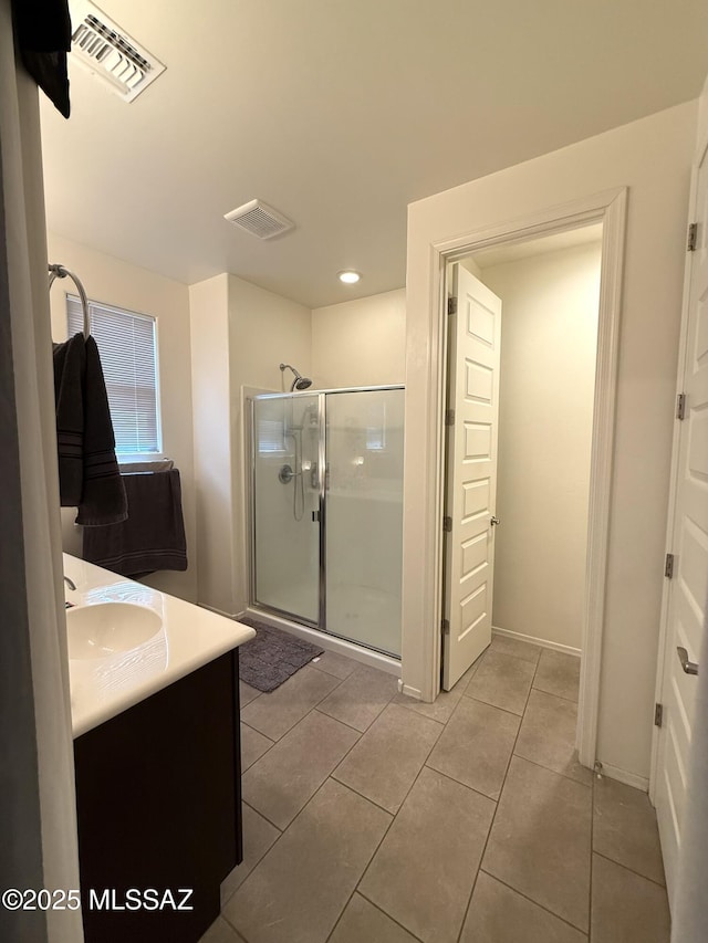 16038 S Camino Casal, Sahuarita, AZ 85629 - bathroom with a stall shower, vanity, tile patterned floors, and recessed lighting