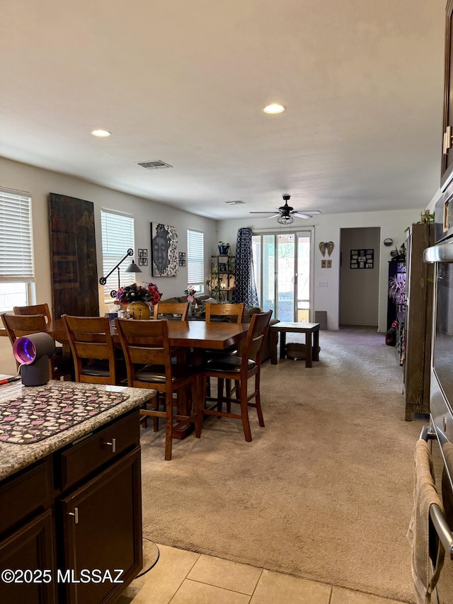16038 S Camino Casal, Sahuarita, AZ 85629 - dining space with light colored carpet, a ceiling fan, recessed lighting, and light tile patterned floors