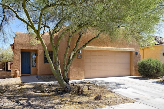 10393 Yew Pl, Tucson, AZ 85747 - southwest-style home with concrete driveway, stucco siding, and a garage