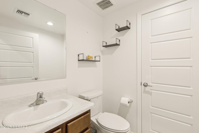 22039 E Thunderhead Dr, Red Rock, AZ 85145 - bathroom with toilet, vanity, and recessed lighting