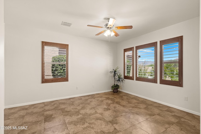 61050 E Amur Ln, Oracle, AZ 85623 - empty room featuring ceiling fan and baseboards