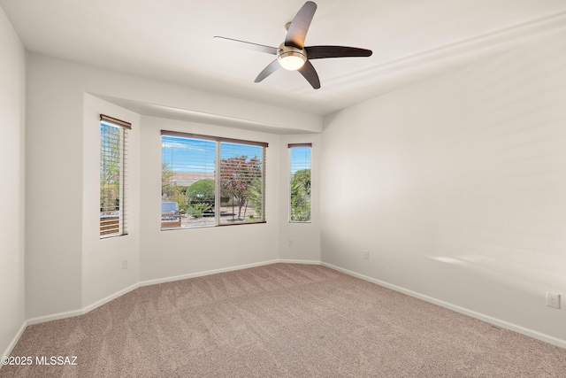 61050 E Amur Ln, Oracle, AZ 85623 - carpeted empty room featuring baseboards and ceiling fan