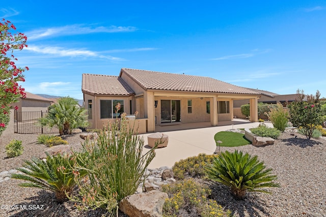 61050 E Amur Ln, Oracle, AZ 85623 - back of house with a tiled roof, stucco siding, and a patio