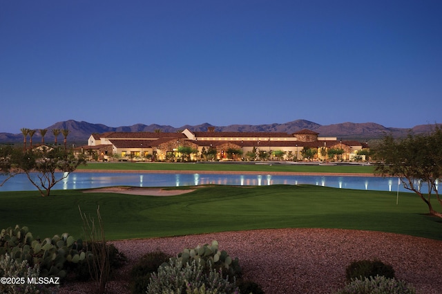 61050 E Amur Ln, Oracle, AZ 85623 - view of home's community with a water and mountain view, an area to practice putting, a lawn, and golf course view