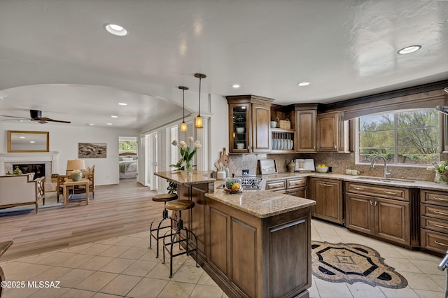 6945 N Mona Lisa Rd, Tucson, AZ 85741 - kitchen with a sink, light tile patterned flooring, ceiling fan, healthy amount of natural light, and recessed lighting