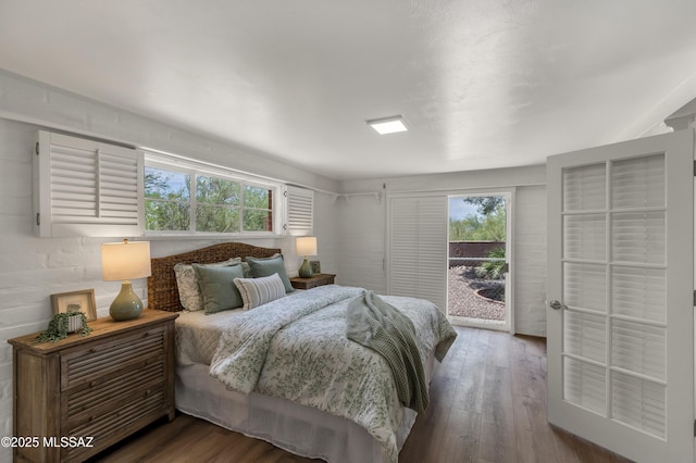 6945 N Mona Lisa Rd, Tucson, AZ 85741 - bedroom with access to outside, multiple windows, and wood finished floors