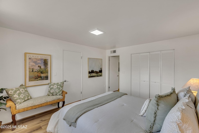 6945 N Mona Lisa Rd, Tucson, AZ 85741 - bedroom featuring a closet and light wood finished floors
