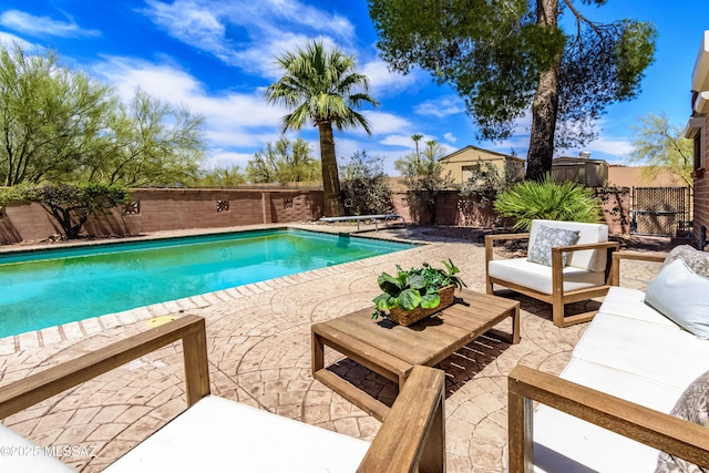 6945 N Mona Lisa Rd, Tucson, AZ 85741 - view of swimming pool with a patio area, a fenced backyard, and an outdoor hangout area