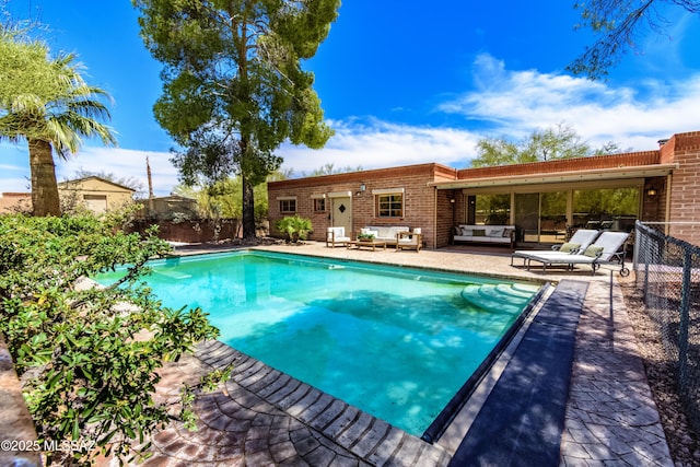6945 N Mona Lisa Rd, Tucson, AZ 85741 - view of pool featuring an outdoor living space and a fenced backyard