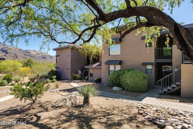 5800 N Kolb Rd Unit 11259, Tucson, AZ 85750 - rear view of property featuring stairs, a mountain view, and stucco siding