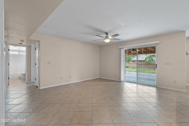941 W Fox Ridge Ln, Oro Valley, AZ 85737 - spare room with ceiling fan, light tile patterned floors, and baseboards