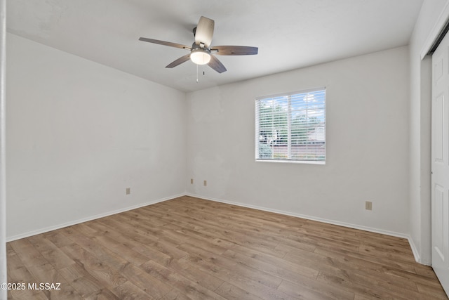 941 W Fox Ridge Ln, Oro Valley, AZ 85737 - spare room with ceiling fan, wood finished floors, and baseboards