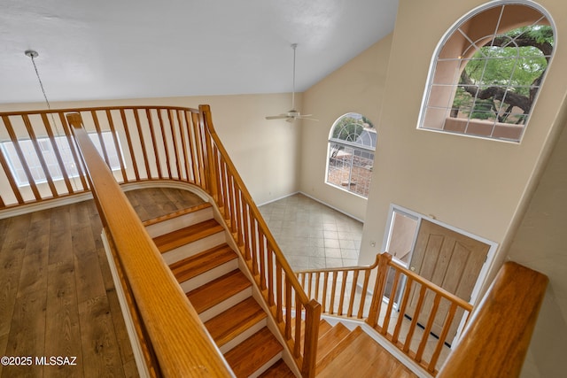 941 W Fox Ridge Ln, Oro Valley, AZ 85737 - stairway with a ceiling fan, wood finished floors, and vaulted ceiling