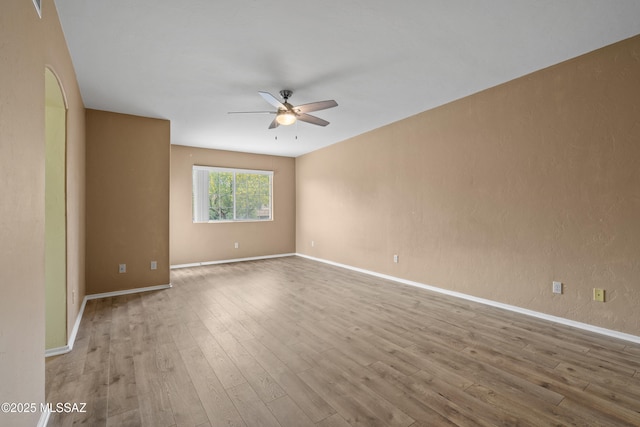 941 W Fox Ridge Ln, Oro Valley, AZ 85737 - unfurnished room with ceiling fan, wood finished floors, and baseboards