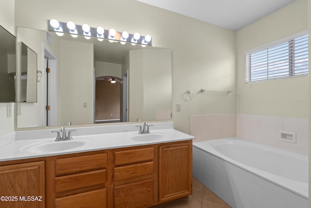 941 W Fox Ridge Ln, Oro Valley, AZ 85737 - bathroom with double vanity, a garden tub, and tile patterned floors