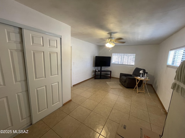 1202 E 26th St, Tucson, AZ 85713 - sitting room with light tile patterned flooring, ceiling fan, and baseboards