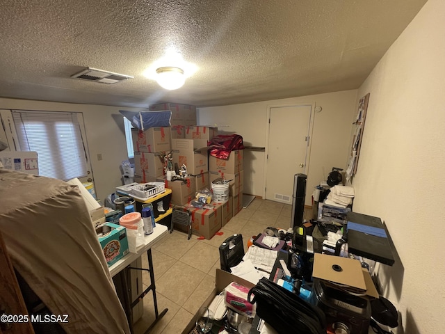 1202 E 26th St, Tucson, AZ 85713 - finished basement with light tile patterned floors and a textured ceiling