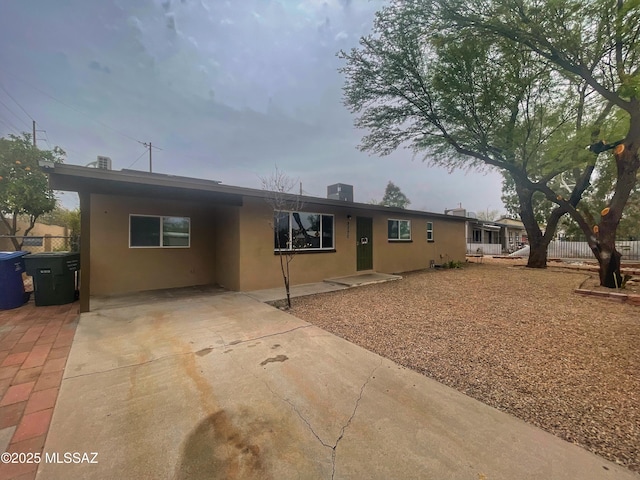 2330 N Los Altos Ave, Tucson, AZ 85705 - ranch-style house with stucco siding, driveway, and a carport