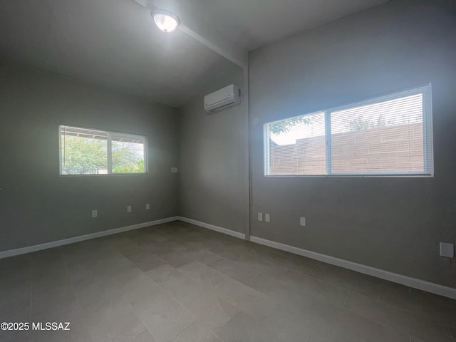2330 N Los Altos Ave, Tucson, AZ 85705 - unfurnished room featuring a wall mounted air conditioner, lofted ceiling, baseboards, and tile patterned floors