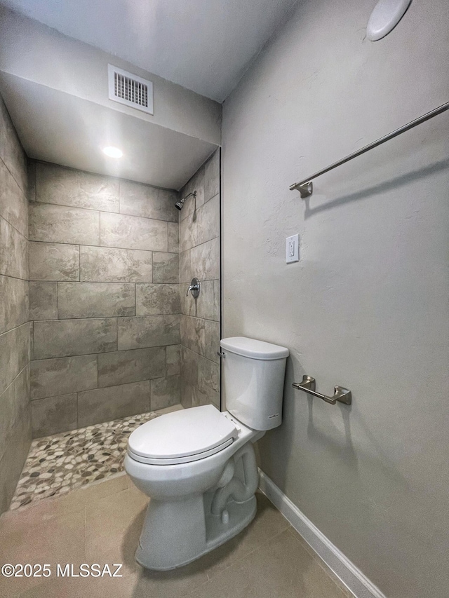 2330 N Los Altos Ave, Tucson, AZ 85705 - full bath featuring toilet, tiled shower, tile patterned floors, and baseboards