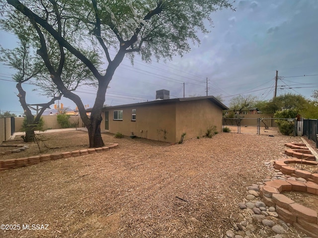 2330 N Los Altos Ave, Tucson, AZ 85705 - view of side of home featuring a fenced backyard and stucco siding